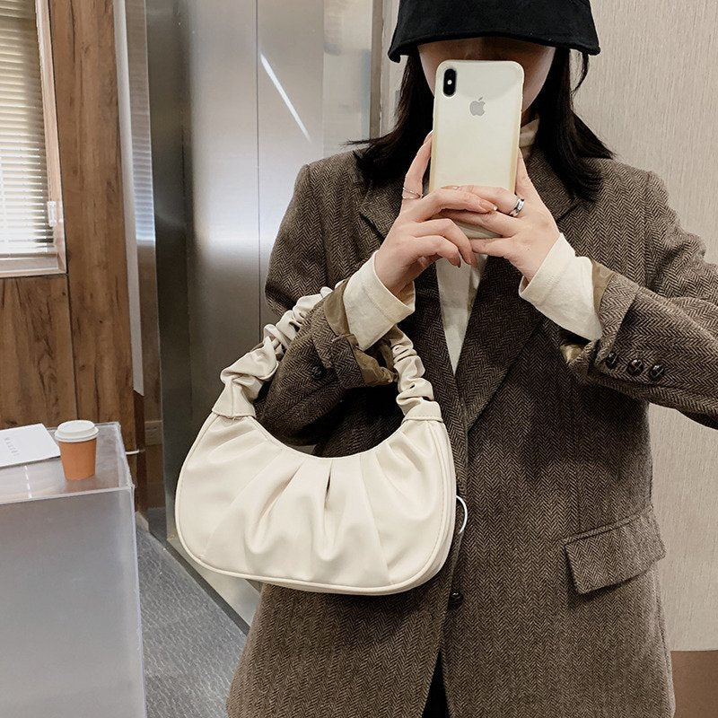 Foreign trade Korean version women's bag 2022 new solid color cloud pleated bag simple women's armpit bag sweet shoulder bag