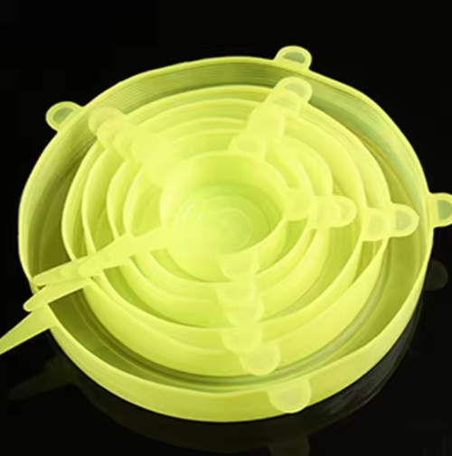 Glowing yellow silicone lid on a black background
